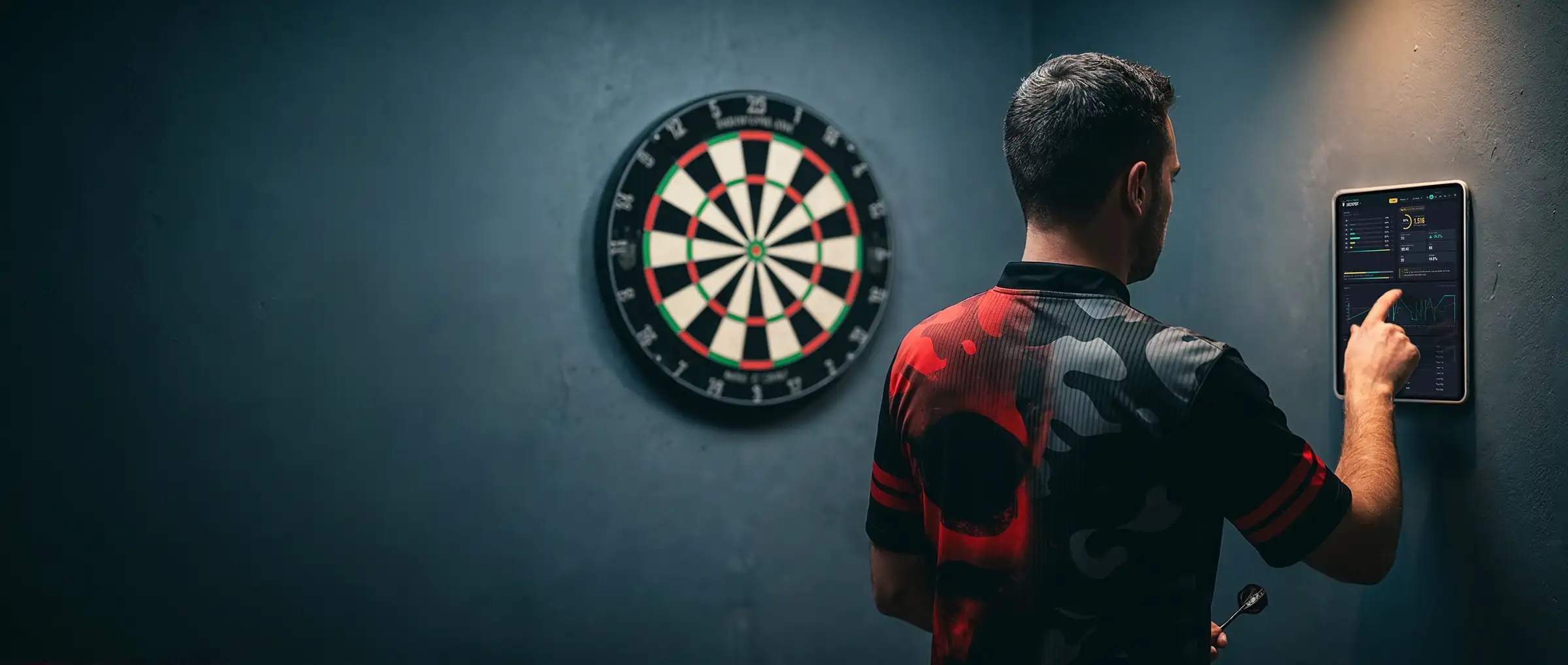 Darts player practising on a dartboard